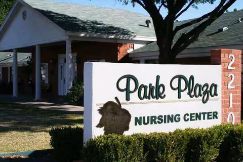 Park Plaza Nursing Center sign in front of an exterior building entrance.