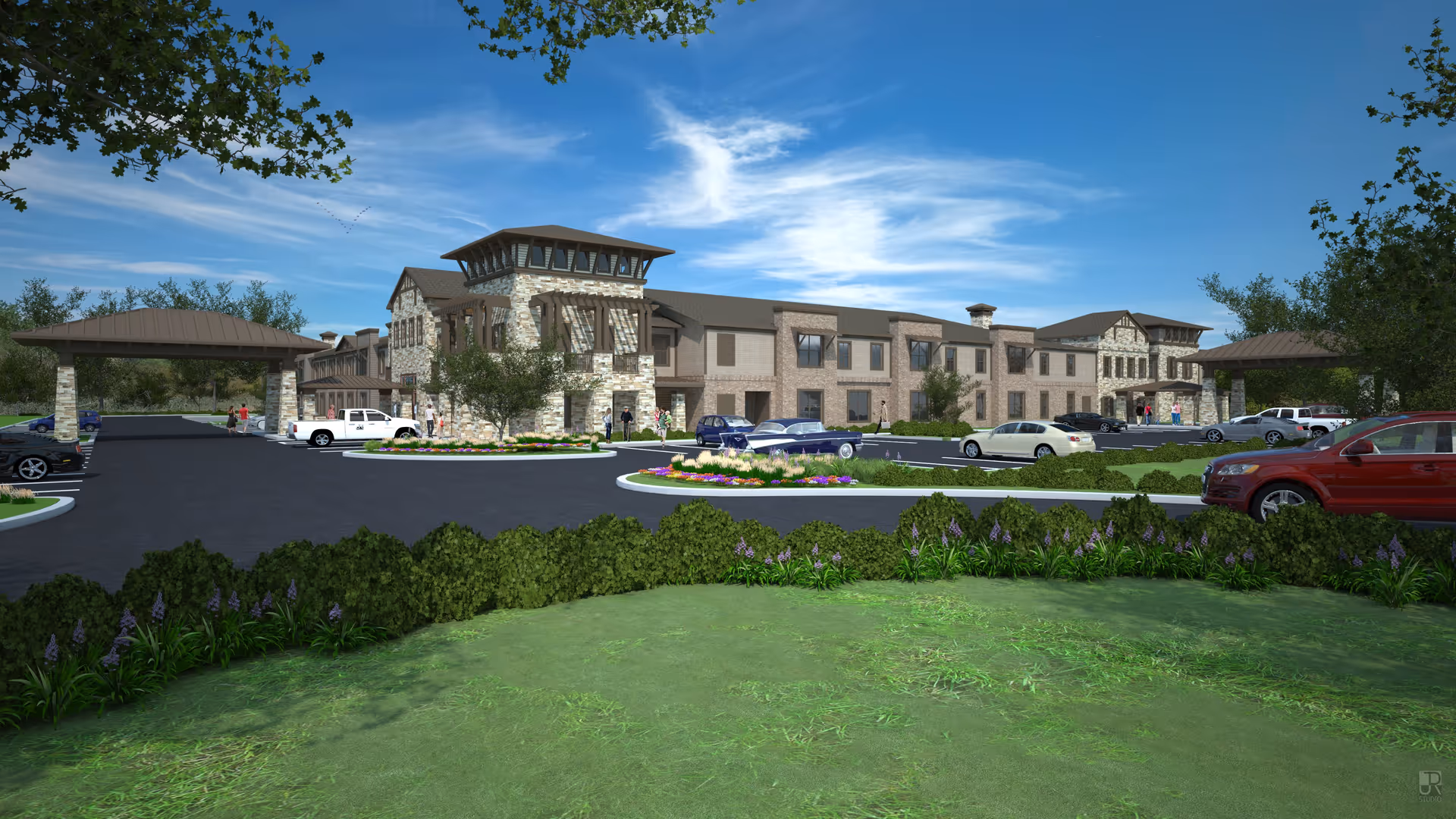 Exterior view of a large senior living facility building with stone and brick facade, surrounded by a parking lot with several cars and landscaped greenery under a blue sky with some clouds.