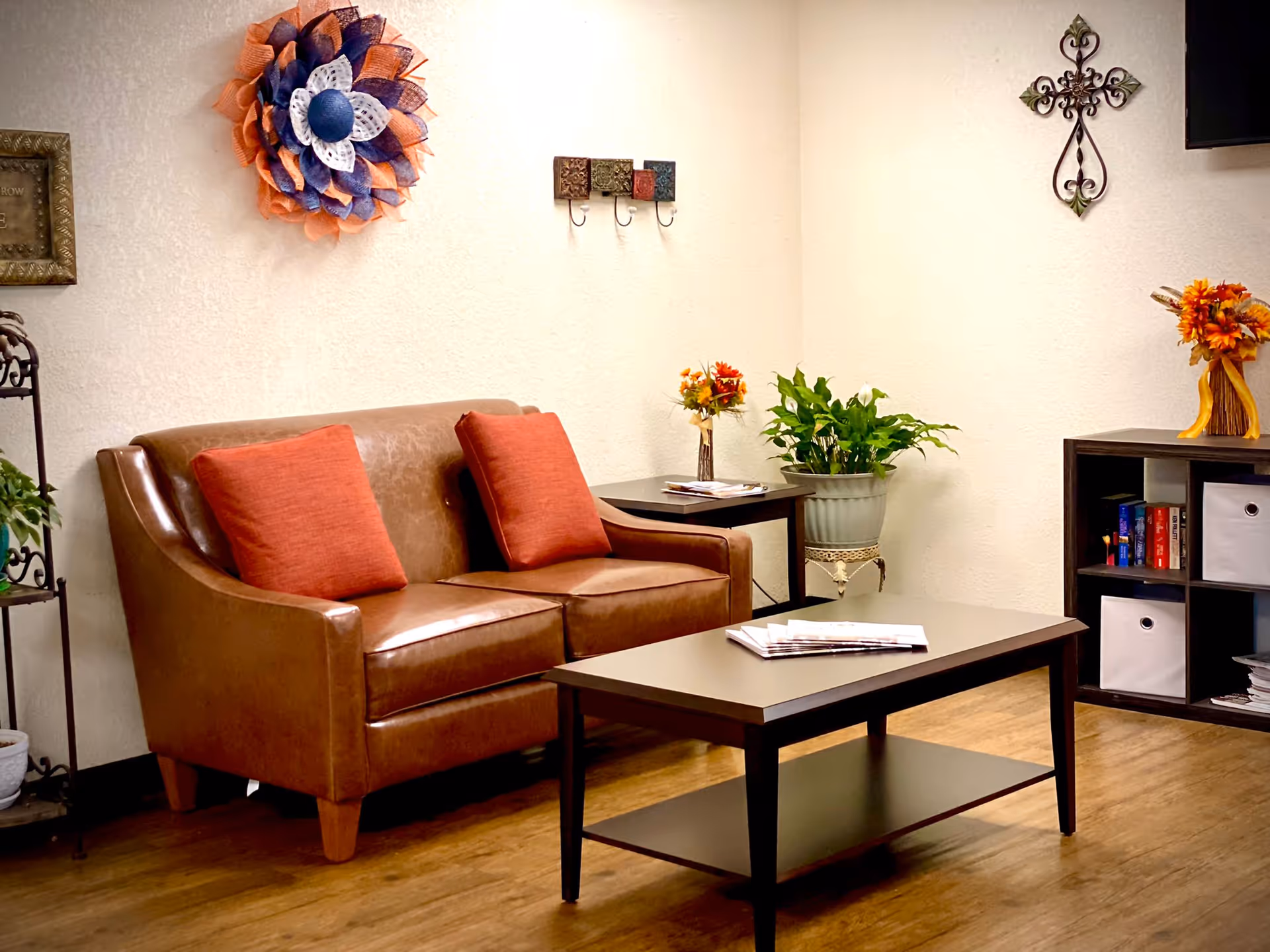 Cozy sitting area with a brown couch and decorative elements.