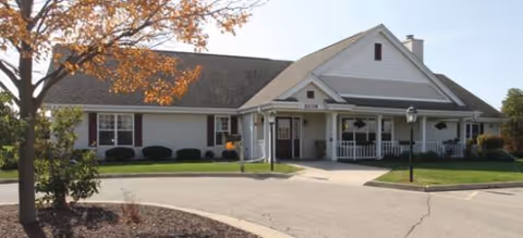 Exterior view of a single-story Kenosha Senior Living facility with a covered entrance.