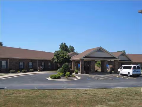 Exterior view of Strafford Care Center with circular driveway and entrance canopy.