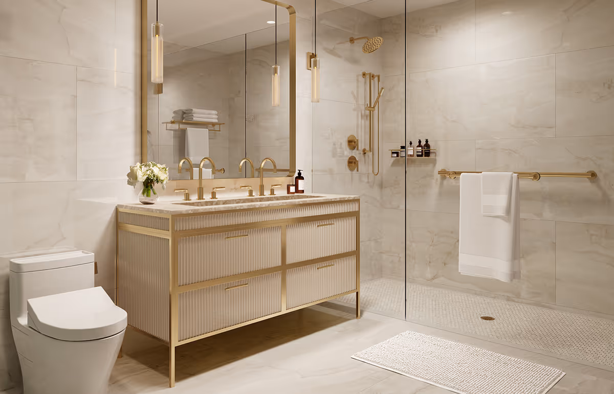 Modern luxurious bathroom with a double-sink vanity, glass-enclosed walk-in shower, toilet, and gold fixtures.