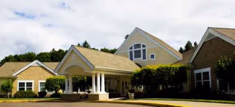 Front view of a Brookdale Salem senior living facility with a covered entry and landscaping.