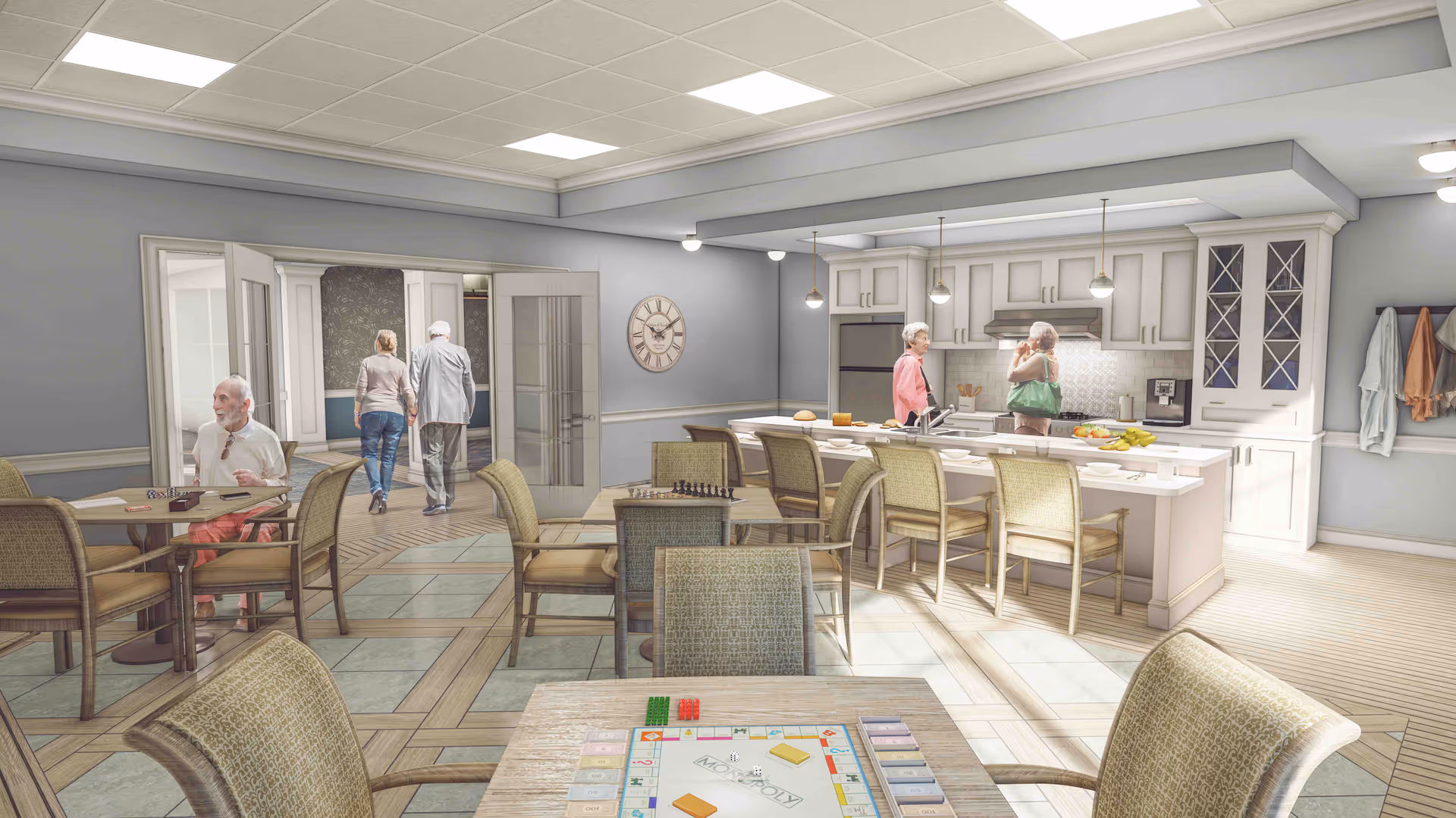 A bright and spacious common area in a senior living facility featuring a kitchen with white cabinetry and a large island with seating. Two elderly women are standing near the kitchen island, one holding a green bag. In the foreground, there are tables and chairs arranged for social activities, with a man sitting at one table playing a board game. In the background, a couple is walking through double glass doors. The room has a light, neutral color palette with tiled flooring and soft lighting.