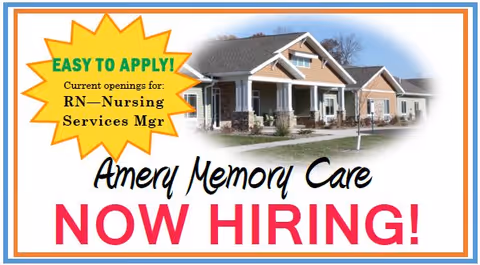Advertisement for Amery Memory Care showing a building exterior with a message stating 'EASY TO APPLY! Current openings for: RN—Nursing Services Mgr' and 'Amery Memory Care NOW HIRING!'