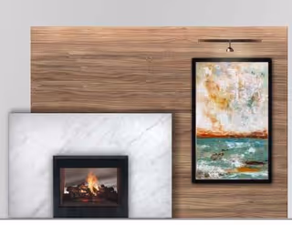 A modern fireplace with a white marble surround and a wooden panel wall above it. To the right of the fireplace, there is a colorful abstract painting in a black frame hanging on the wooden wall.