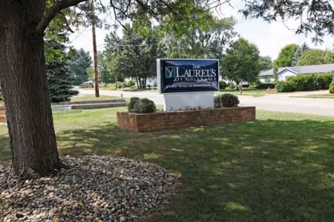 Outdoor view of The Laurels of Coldwater sign on a grassy lawn