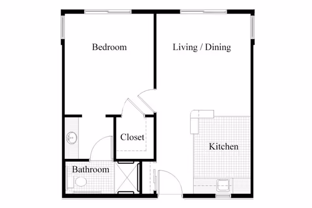 Floor plan of a senior living unit at The Abbewood showing a bedroom, bathroom, closet, living/dining area, and kitchen.