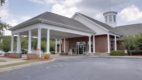 Rockdale Healthcare Center exterior with brick facade and covered entrance.