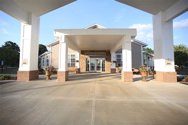 Front entrance of Danbury Massillon senior living facility with a covered porte-cochère.