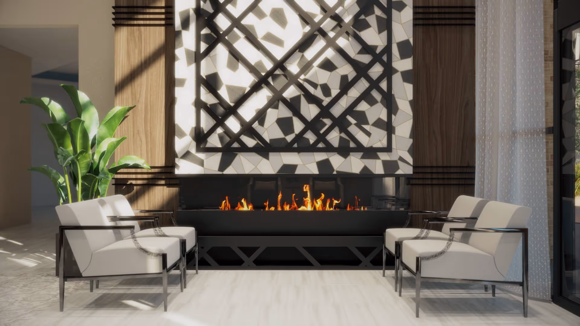 A modern interior seating area with four white cushioned chairs arranged around a long, rectangular fireplace with visible flames. Behind the fireplace is a decorative wall with geometric patterns casting shadows. There is a large green plant on the left side and sheer curtains on the right side letting in natural light.