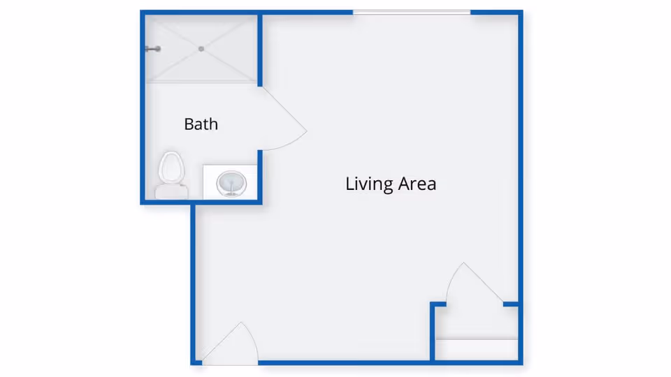 Floor plan layout showing a living area and a bathroom with a shower, toilet, and sink.