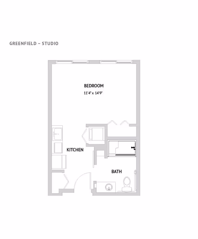 Black-and-white studio apartment floor plan labeled "Greenfield - Studio" showing a bedroom, kitchen, and bathroom layout.