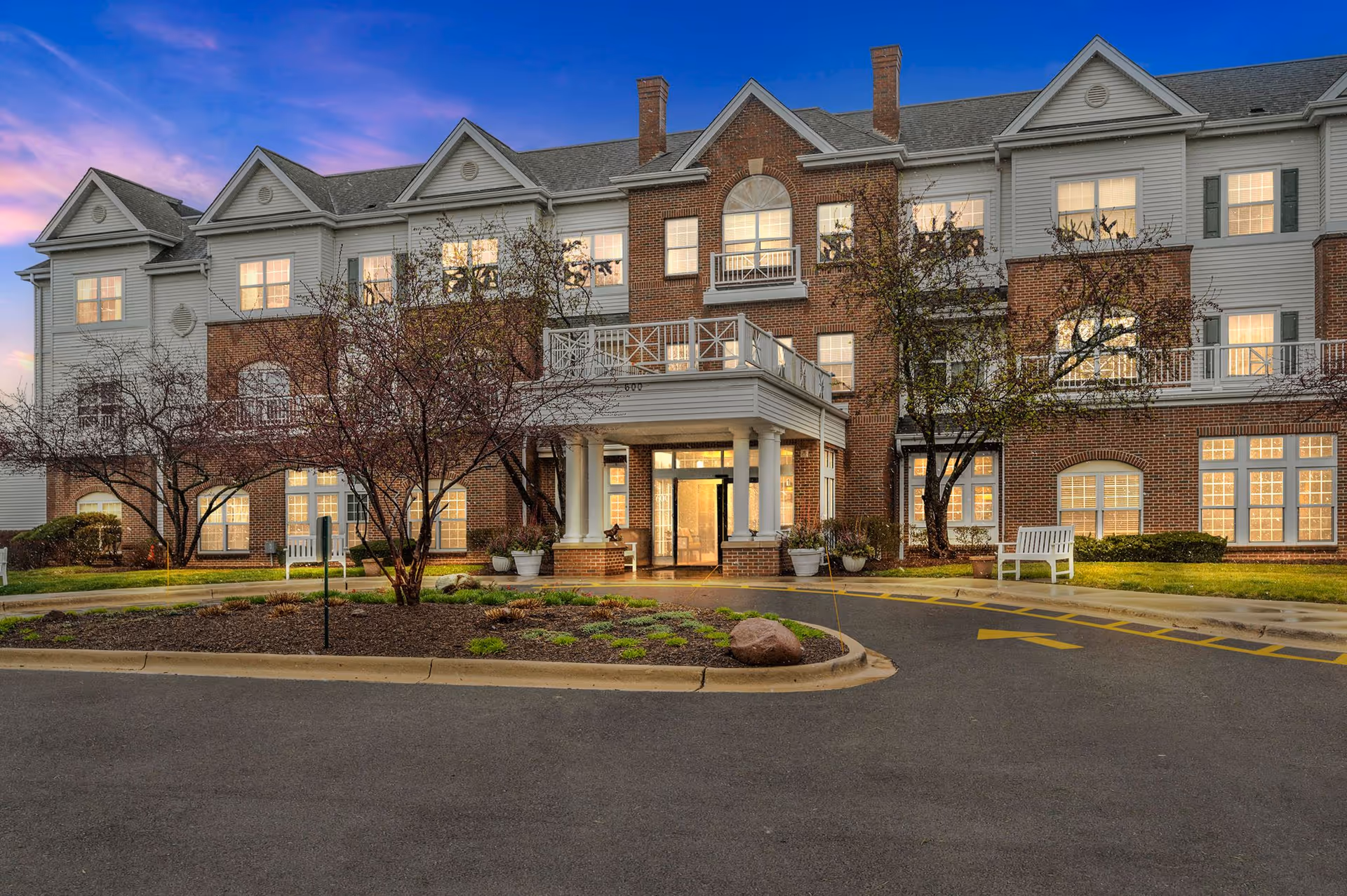 Exterior view of Brighton Gardens of St. Charles showing brick facade and entrance.
