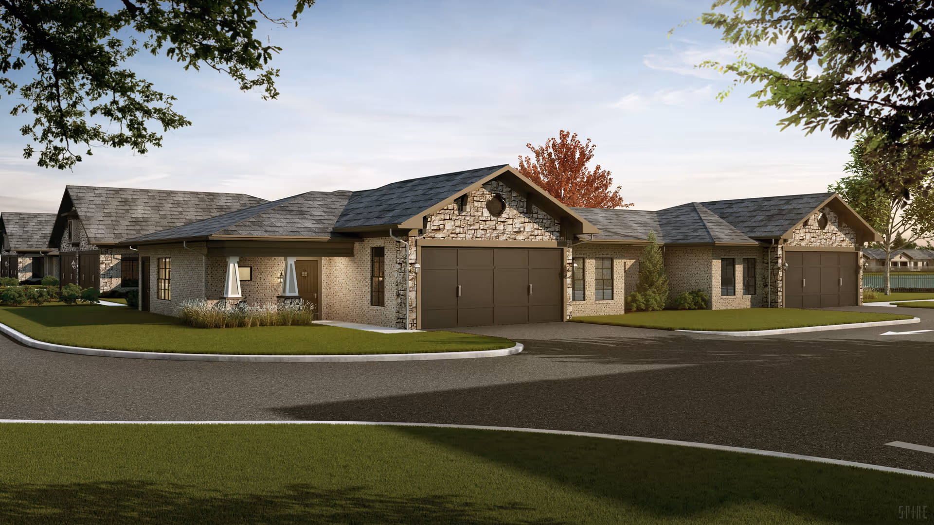 Single-story brick and stone residential buildings with attached garages along a curved driveway and landscaped lawns.