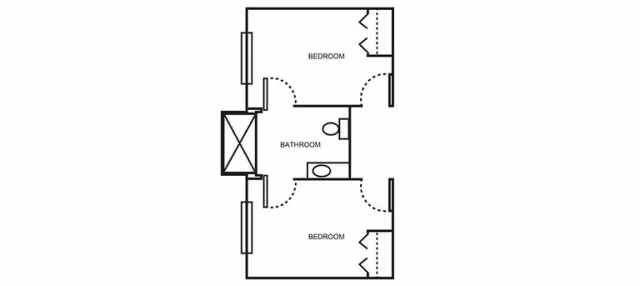 Black-and-white floor plan showing two bedrooms flanking a central bathroom with fixtures and doors.