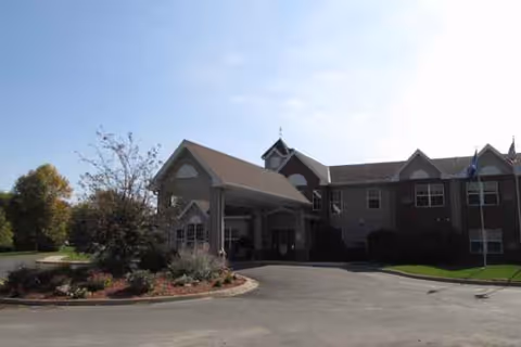 Cokato Manor exterior with a covered entrance and circular driveway.