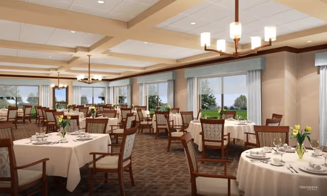 Spacious dining room with round tables set for meals, wooden chairs, chandeliers, and large windows overlooking greenery.