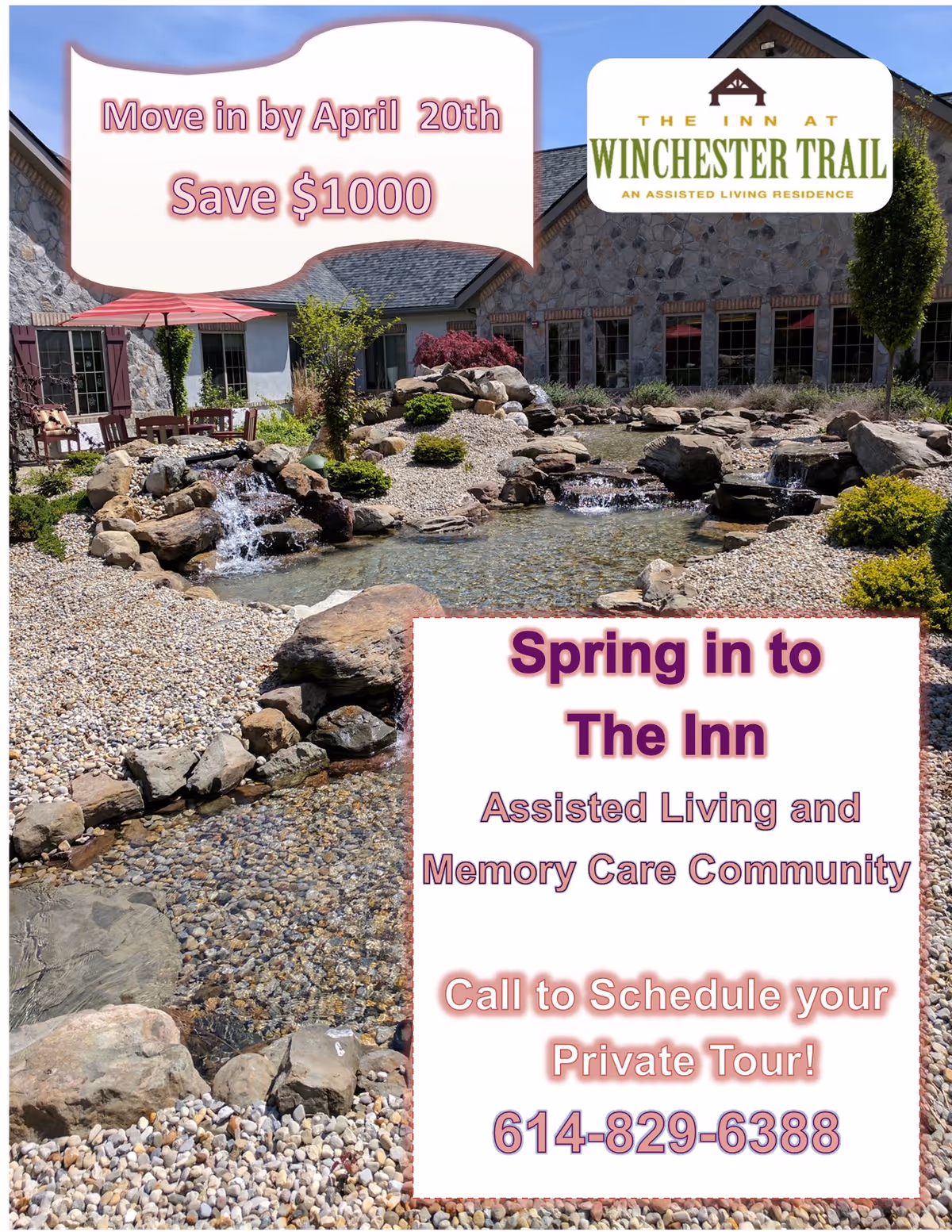 Outdoor view of a landscaped garden area at The Inn at Winchester Trail featuring a small pond with cascading waterfalls, surrounded by rocks, shrubs, and trees, with a stone building in the background.