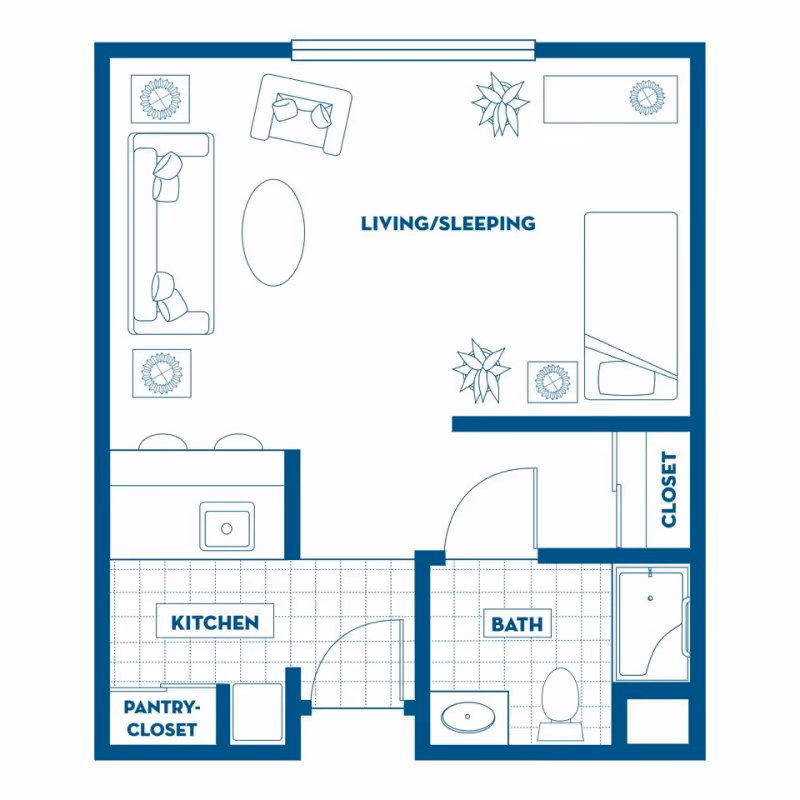 Floor plan of a small apartment unit showing a combined living and sleeping area with a sofa, chair, coffee table, bed, and plants. The unit includes a kitchen with a pantry-closet, and a bathroom with a sink, toilet, and bathtub. There is also a closet near the sleeping area.