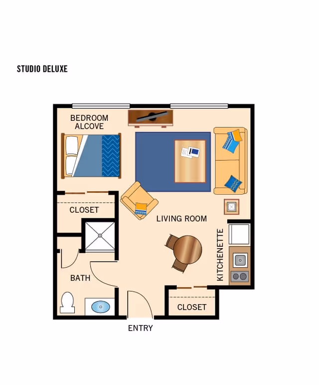 Floor plan titled 'Studio Deluxe' showing a studio apartment layout with a bedroom alcove, living room, kitchenette, bathroom, closets, and entry.