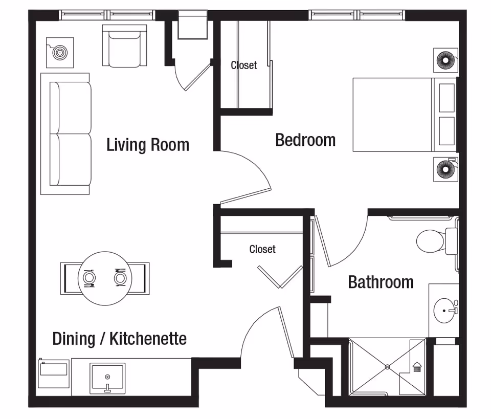 Floor plan of a one-bedroom apartment at Deer Path of Huntley showing a living room with sofa and chair, a dining/kitchenette area with a table and two chairs, a bedroom with a bed and two nightstands, a bathroom with a shower, toilet, and sink, and two closets.