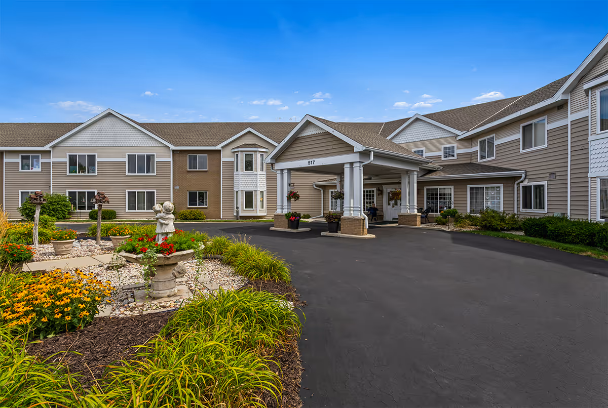 Exterior view of LakeHouse Fond du Lac with covered entrance and landscaped grounds