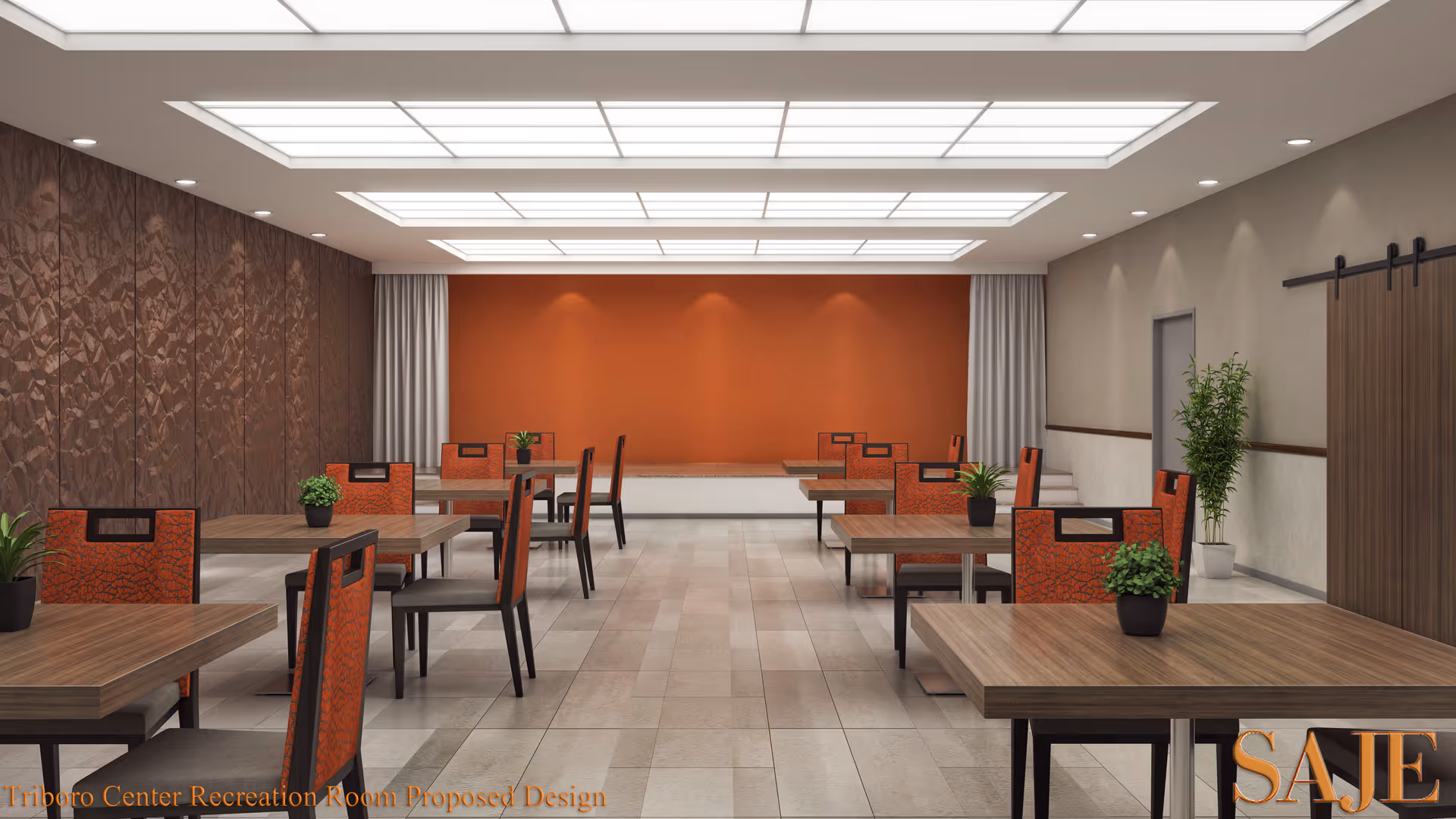 A modern recreation room with multiple wooden tables and orange cushioned chairs arranged neatly. The room features a textured brown wall on the left, an orange accent wall at the far end, and a light beige wall on the right with a sliding barn door and a potted plant. The ceiling has large rectangular light panels providing bright illumination.