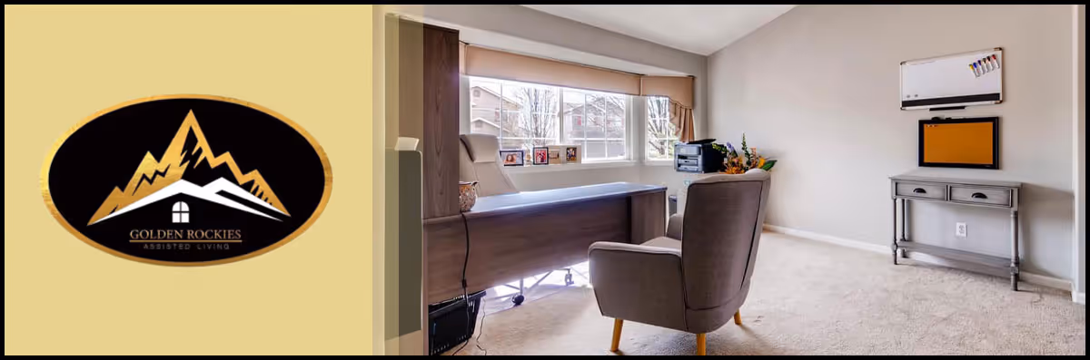 A bright office space with a large window letting in natural light. The room features a modern desk with a chair behind it and a comfortable armchair in front. On the right wall, there is a small console table with a bulletin board and whiteboard above it. The floor is carpeted and the walls are painted a light color.