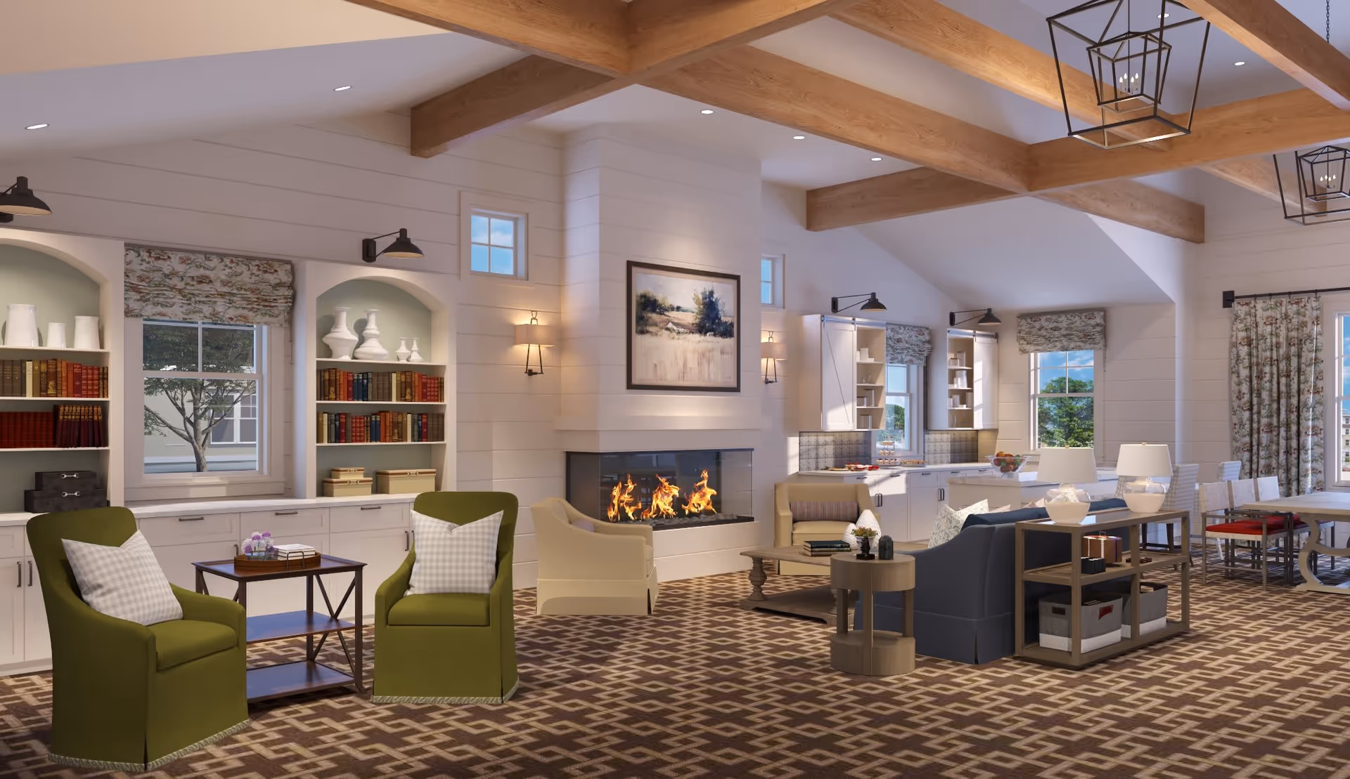 A spacious and cozy living room area with wooden ceiling beams, a lit fireplace, green armchairs with checkered pillows, a blue sofa, and a dining table with chairs near windows with floral curtains. Built-in shelves with books and decorative items flank the fireplace, and the room has a patterned carpet.