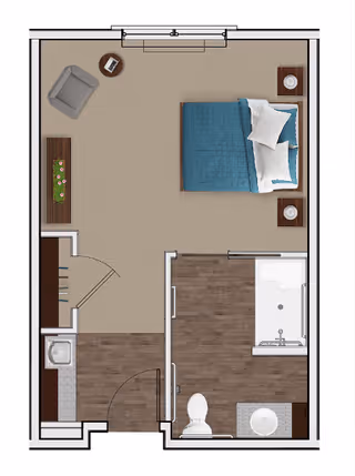 Top-down floor plan of a senior living studio apartment featuring a bedroom area with a bed, two nightstands, and a chair. The apartment includes a small kitchenette with a sink and counter, and a bathroom with a toilet, sink, and bathtub. The flooring is a mix of carpet in the bedroom and wood in the kitchenette and bathroom.