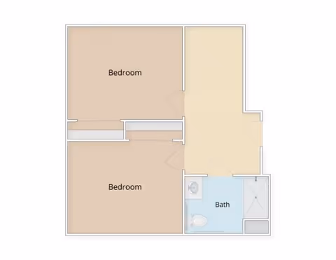 Top-down floor plan of a two-bedroom unit with a shared bathroom and an entry/living area.