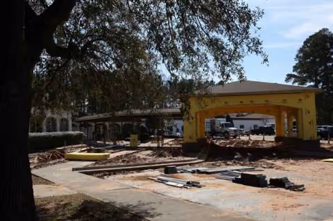 Construction site in front of Meadowview Health & Rehab Center with a yellow archway.