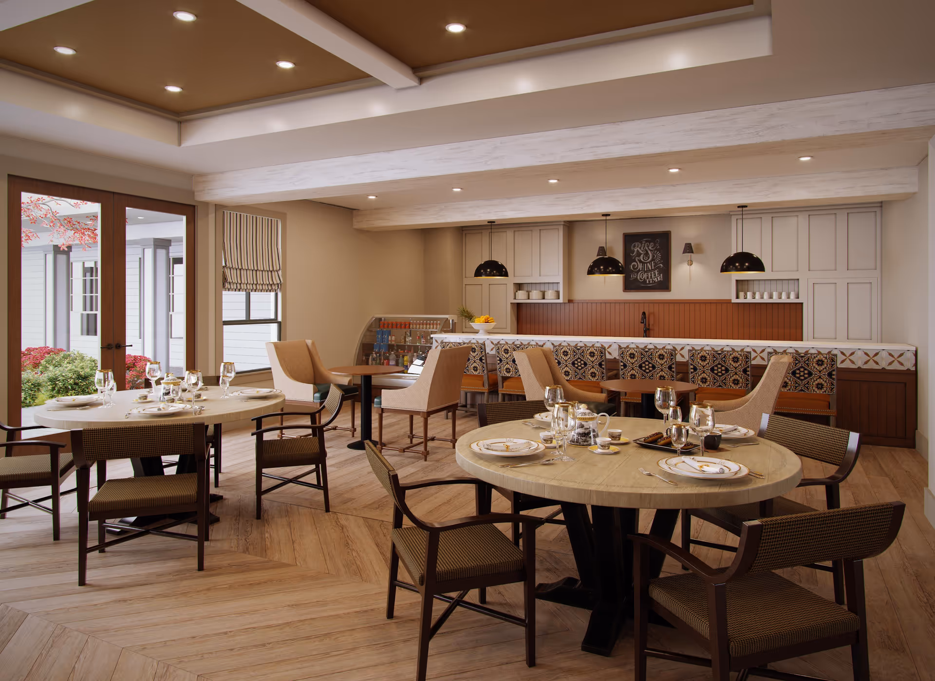 Bright communal dining area with round set tables, chairs, and a service counter/bar in the background.