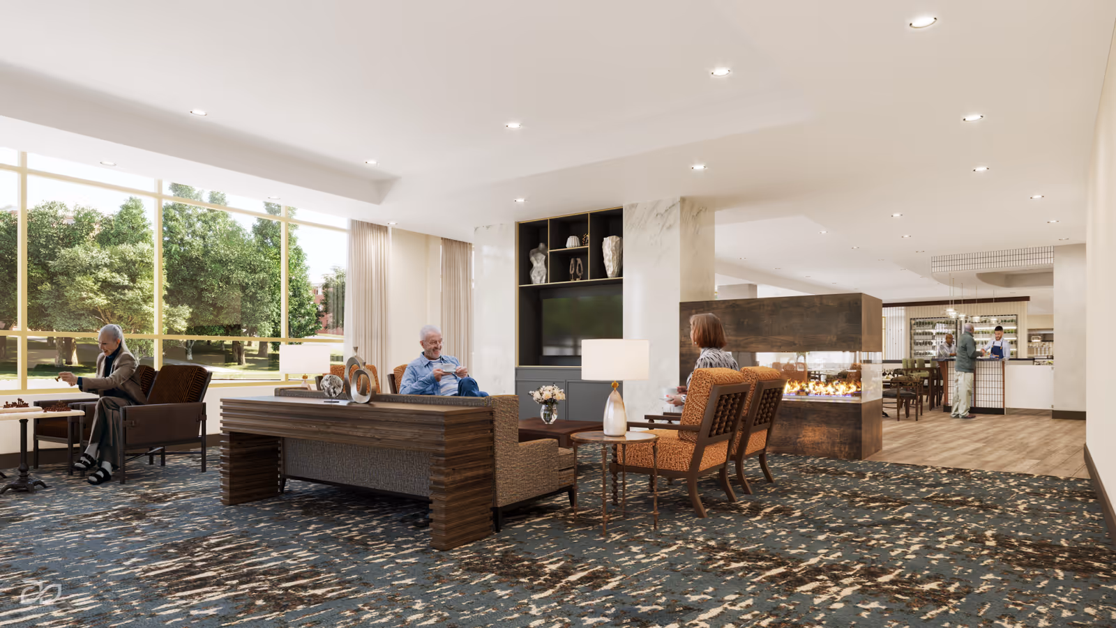Open senior living common lounge with seating around a fireplace, a dining area in the back, and large windows overlooking trees.