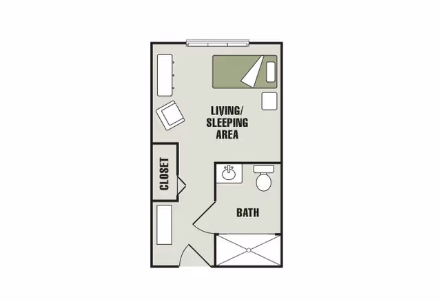 Floor plan of a small living space labeled 'Living/Sleeping Area' with a bed, chair, and table. There is a closet near the entrance and a bathroom with a sink, toilet, and shower.