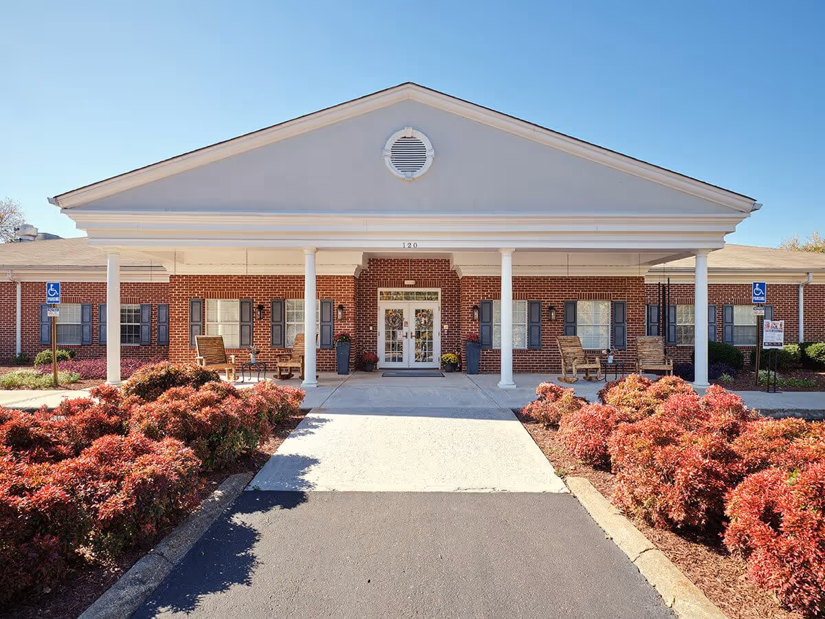 TerraBella Athens senior living facility front: brick building with white columns and a covered entry.