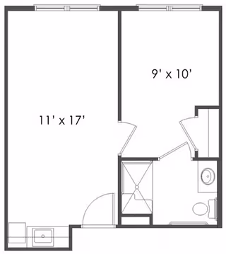 Architectural floor plan showing a layout with a main room measuring 11 feet by 17 feet, a smaller room measuring 9 feet by 10 feet, and a bathroom area with a shower, toilet, and sink.