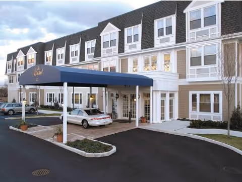 Exterior view of The Bristal Assisted Living at North Woodmere entrance.