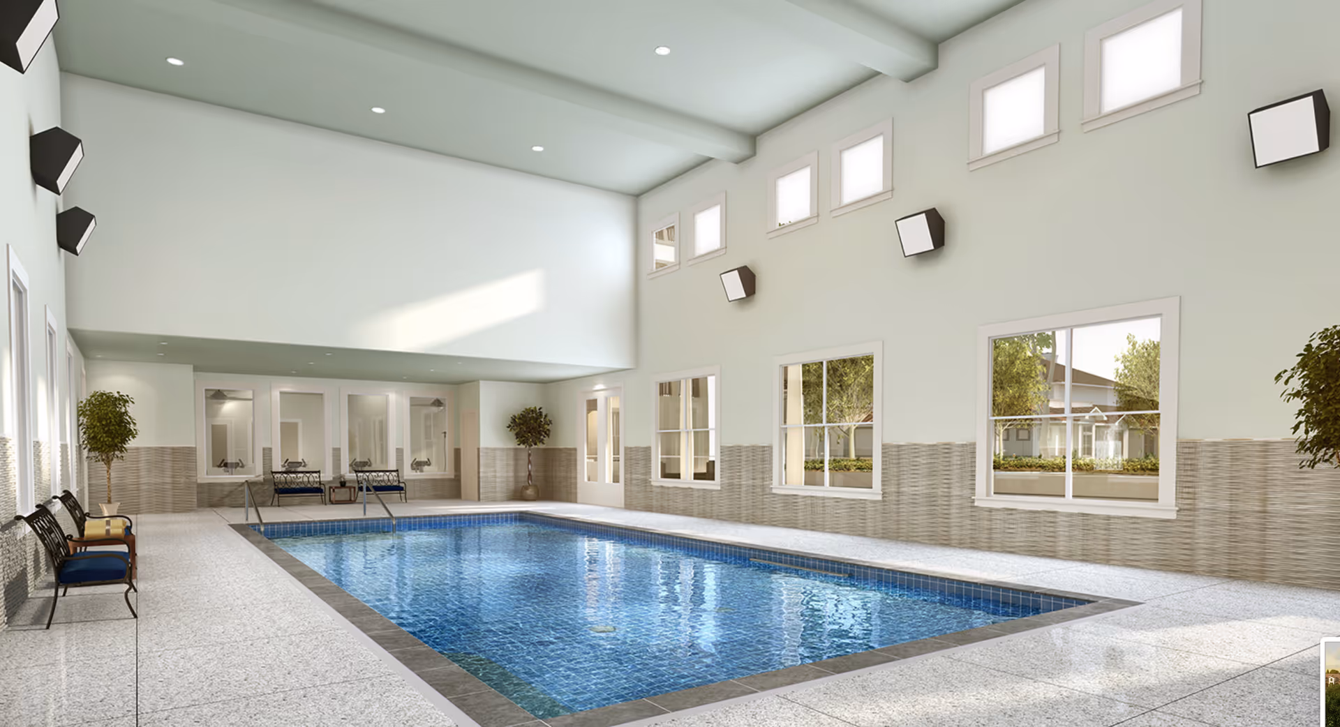 Bright indoor swimming pool room with high clerestory windows, tiled deck, benches and potted plants.