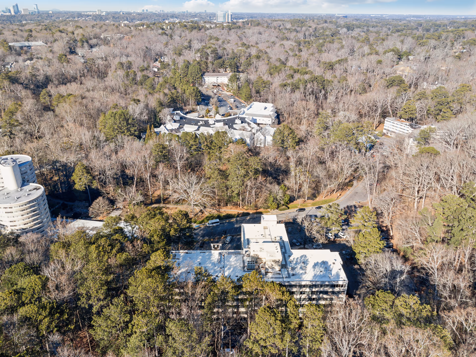 Aerial view of the Parkside at Budd Terrace nursing and rehab complex surrounded by trees and roads.