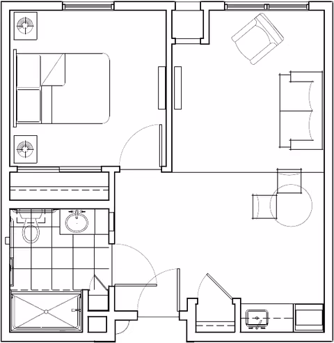 Architectural floor plan of a one-bedroom apartment featuring a bedroom with a bed and two nightstands, a bathroom with a shower, toilet, and sink, a living room with a sofa, armchair, and a small table with two chairs, and an entry area with a closet and a small kitchenette.