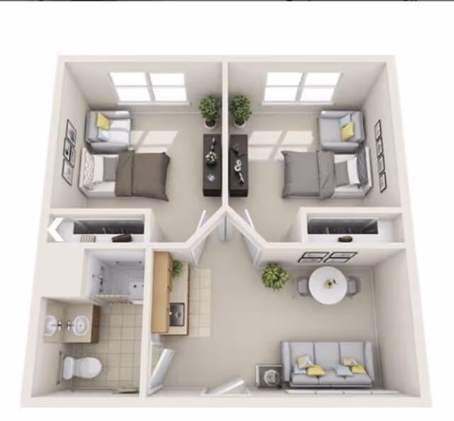 3D floor plan of a small assisted living apartment with two bedrooms, each containing a bed, armchair, and side table. The apartment also includes a living room with a sofa and round dining table with chairs, a kitchen area with a sink and counter, and a bathroom with a toilet, sink, and shower.