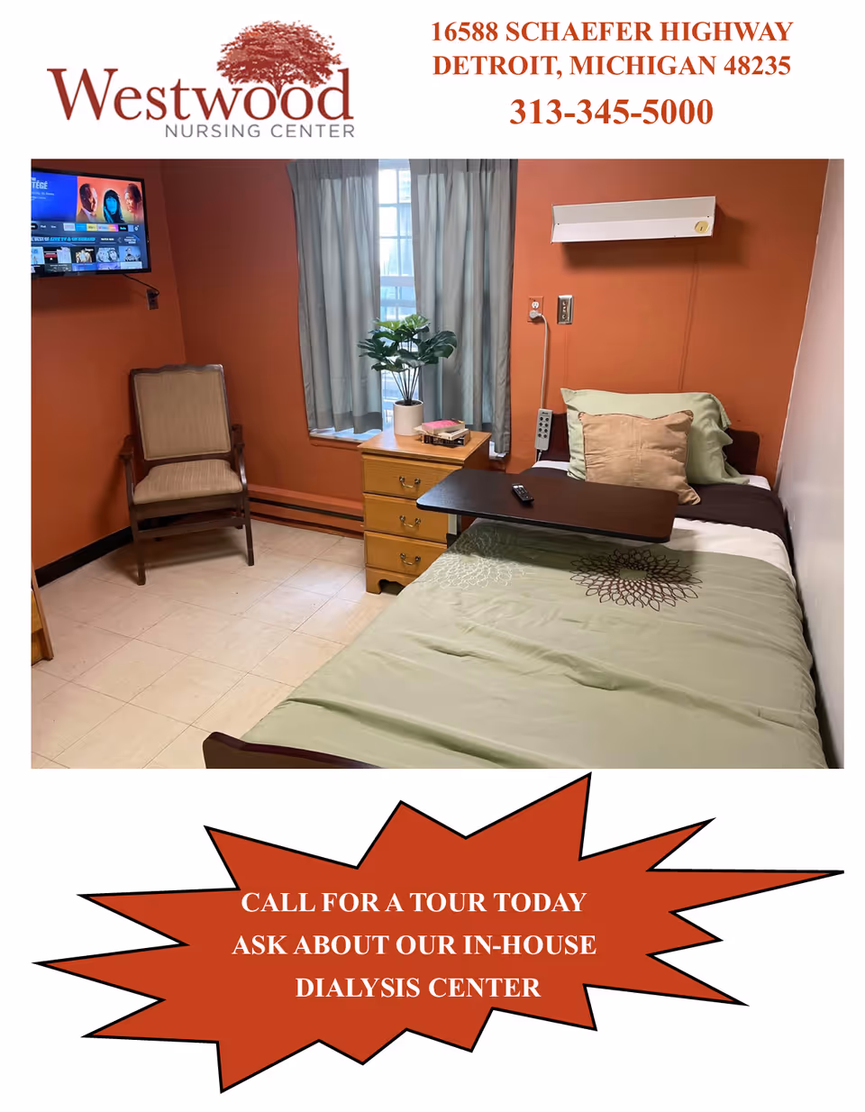A small, cozy nursing center room with an orange accent wall, a single bed with green bedding and pillows, a wooden bedside table with a potted plant and books, a beige cushioned chair, and a wall-mounted TV.