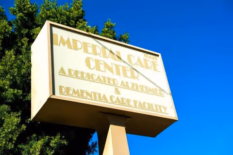 Exterior sign reads Imperial Care Center, a dedicated Alzheimer's and dementia care facility.