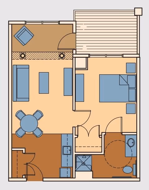 Floor plan of a residential unit showing a living room with sofa, armchair, coffee table, and dining table with four chairs; a kitchen area; a bedroom with a bed and nightstands; a bathroom with a shower, toilet, and sink; and an outdoor patio area.