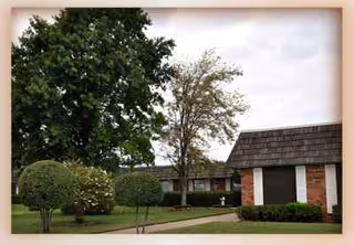 Exterior view of Grace Care Center of Olney with brick front, walkway, and landscaping.