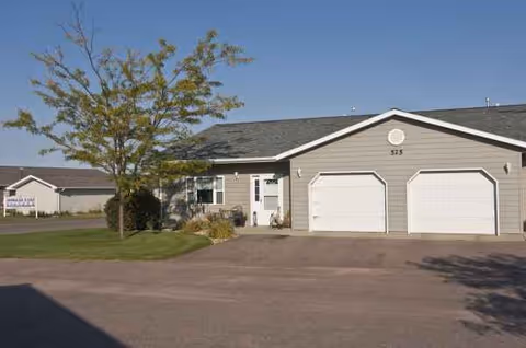 Exterior view of a retirement living facility with a two-garage front.