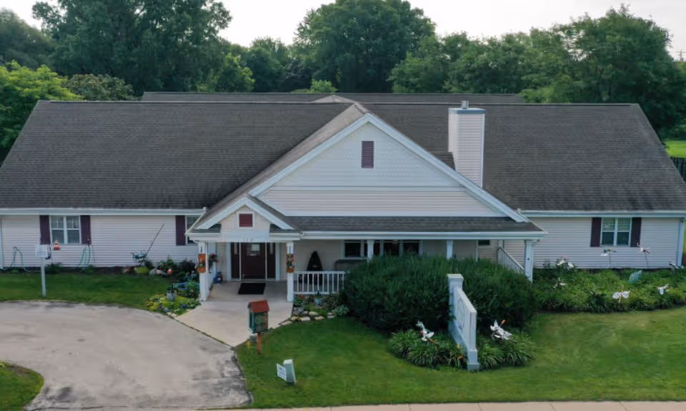 Exterior view of Lakepoint Villa Assisted Living, a single-story building with a manicured front yard.