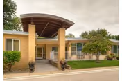 Exterior view of the South Haven Nursing and Rehab entrance with brick pillars and landscaping.